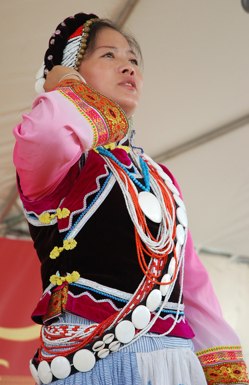 a woman wearing an outfit standing on stage