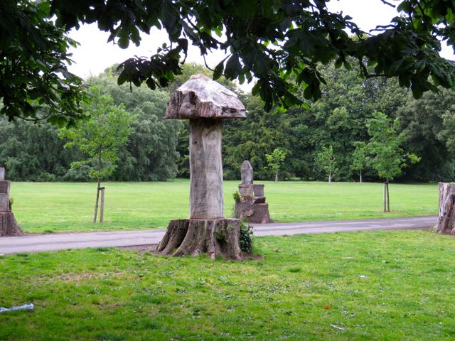 large statues in a park near a path