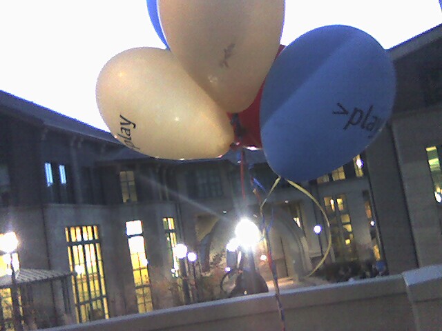 a bunch of balloons that say joy on them