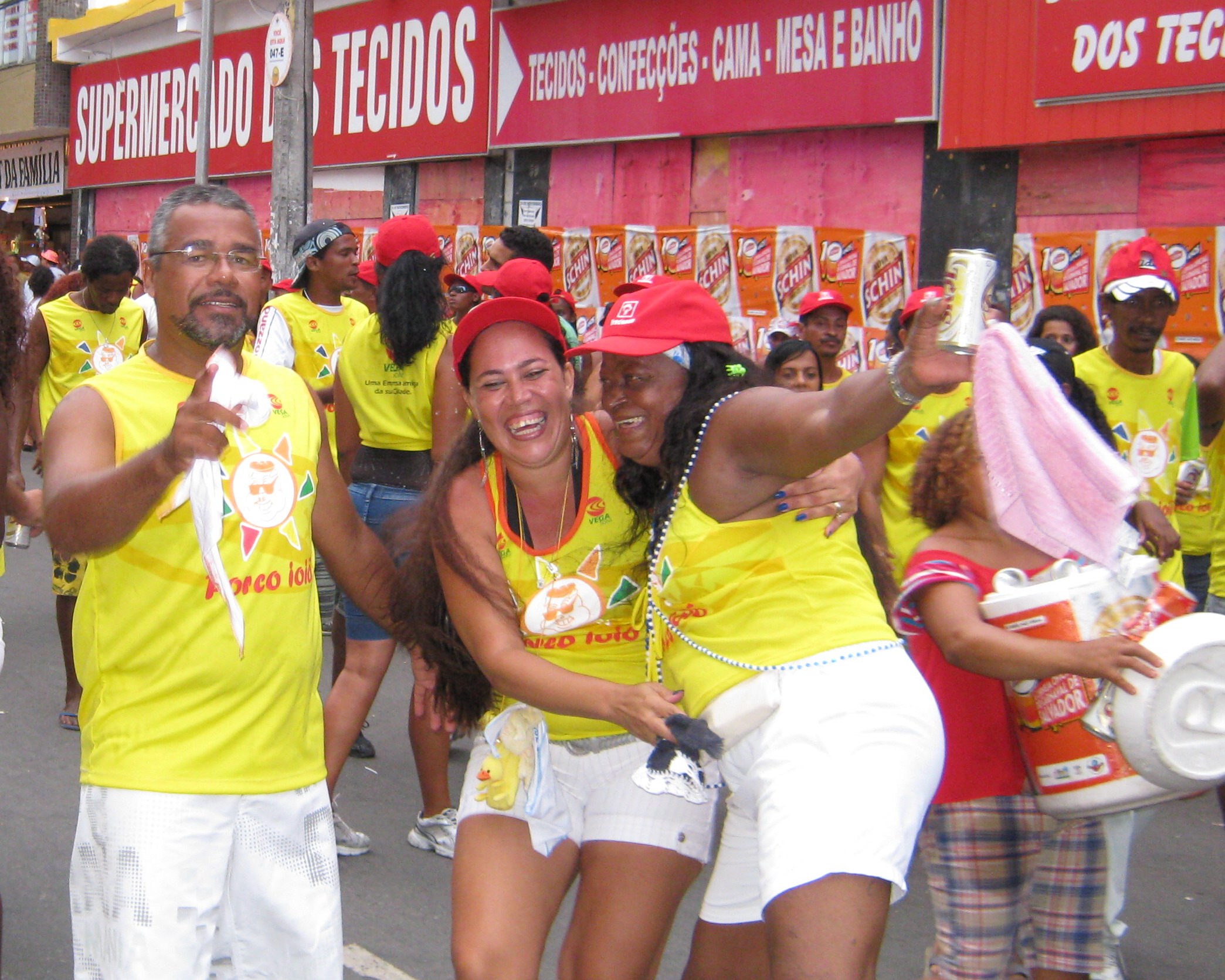 a group of people holding onto some drinks