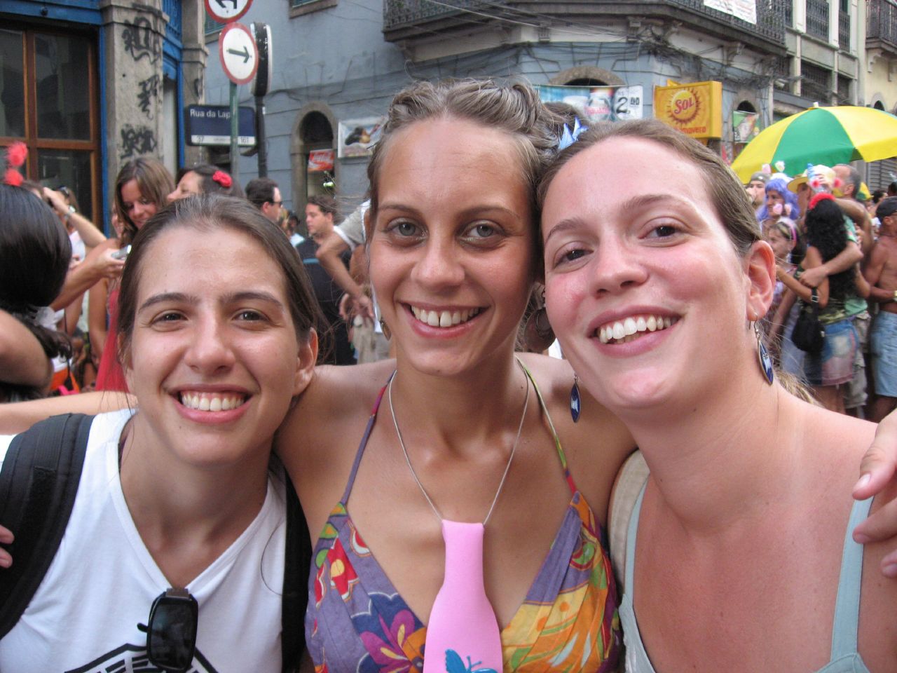 three women who are standing together at the festival