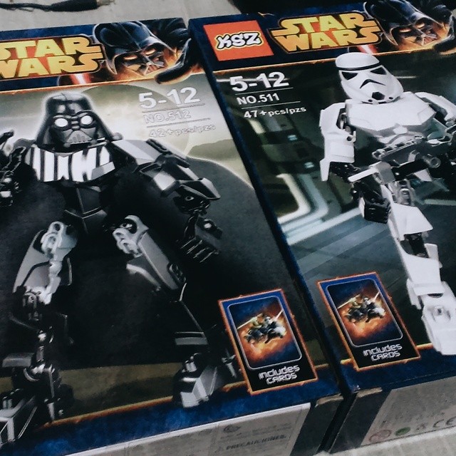 two new lego darth vaders in boxes