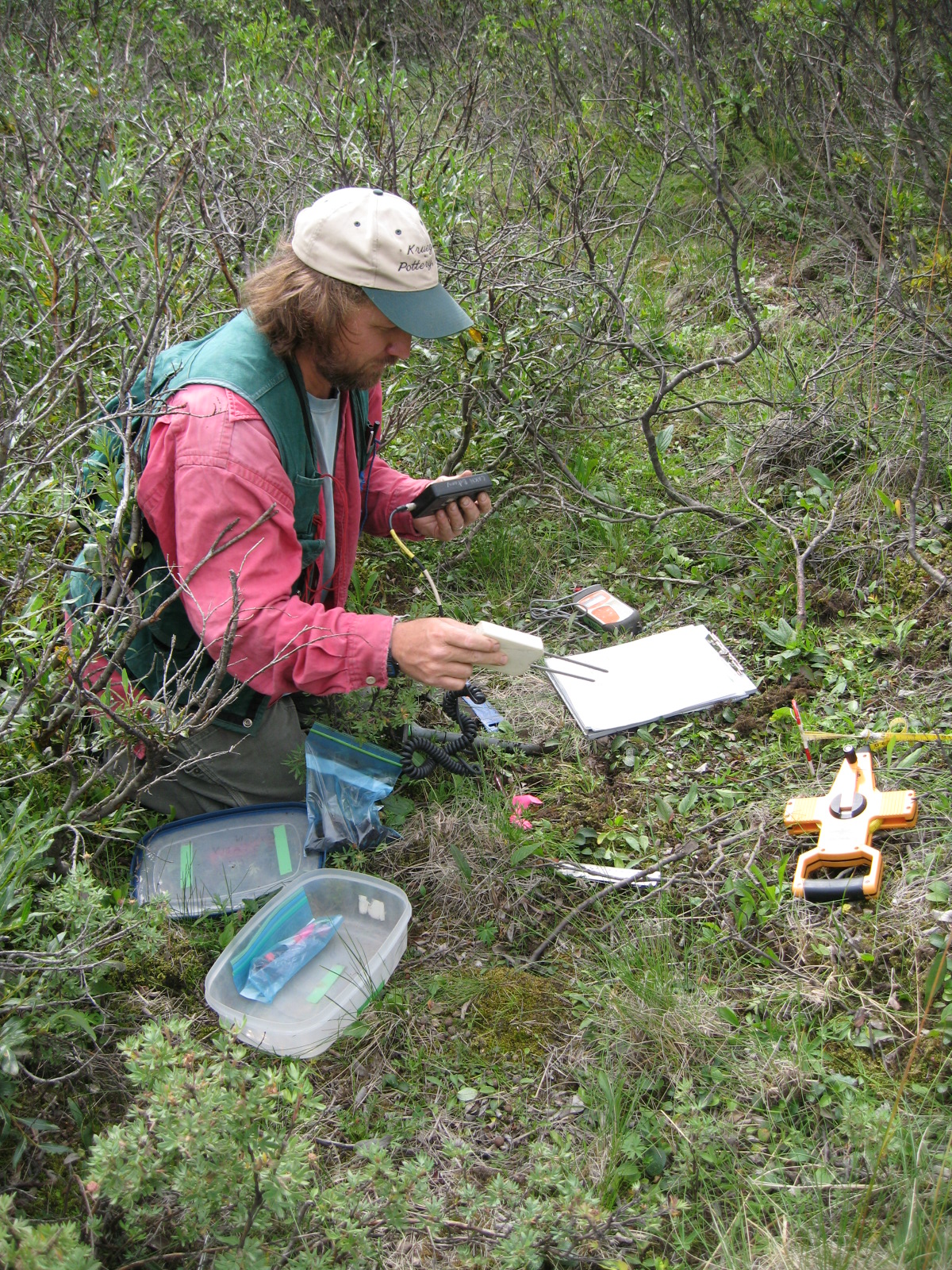 a man in a field with a remote control