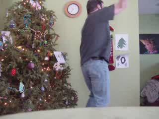 a man is standing on a christmas tree