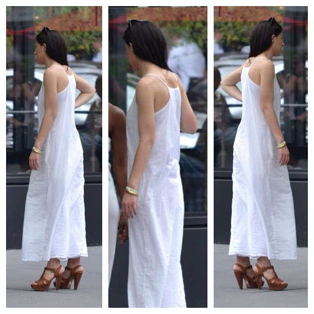 the rear of a woman's dress is in white