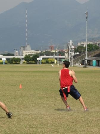 two men in the grass playing a game