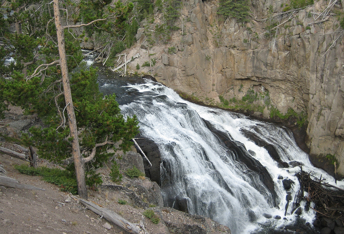 the water falls down a rock face