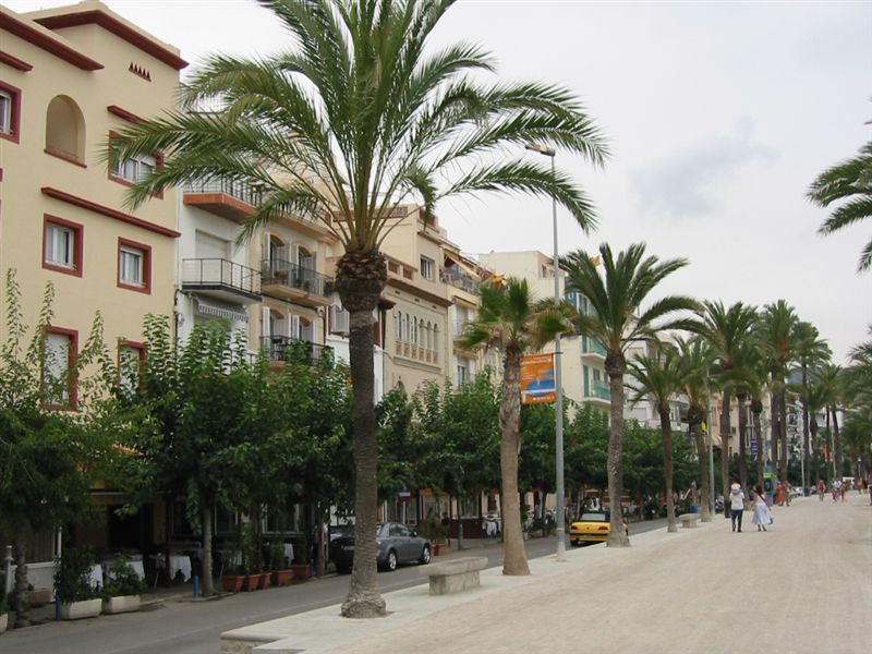 people walking in the distance on the street