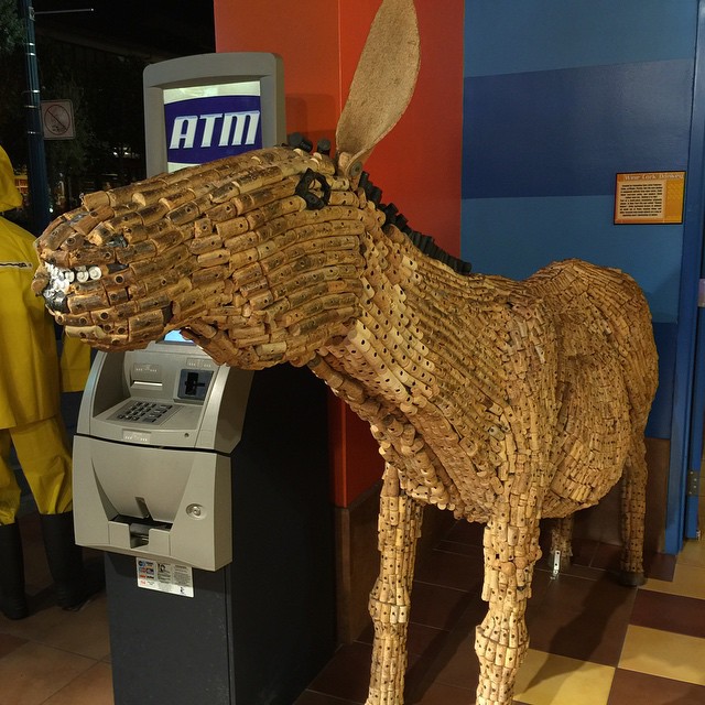 a cardboard sculpture of a bull made from paper strips