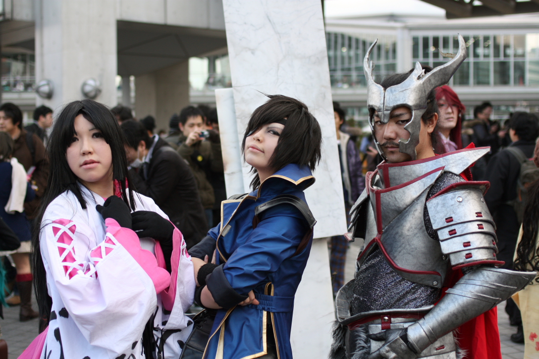 two cosplay characters standing next to each other