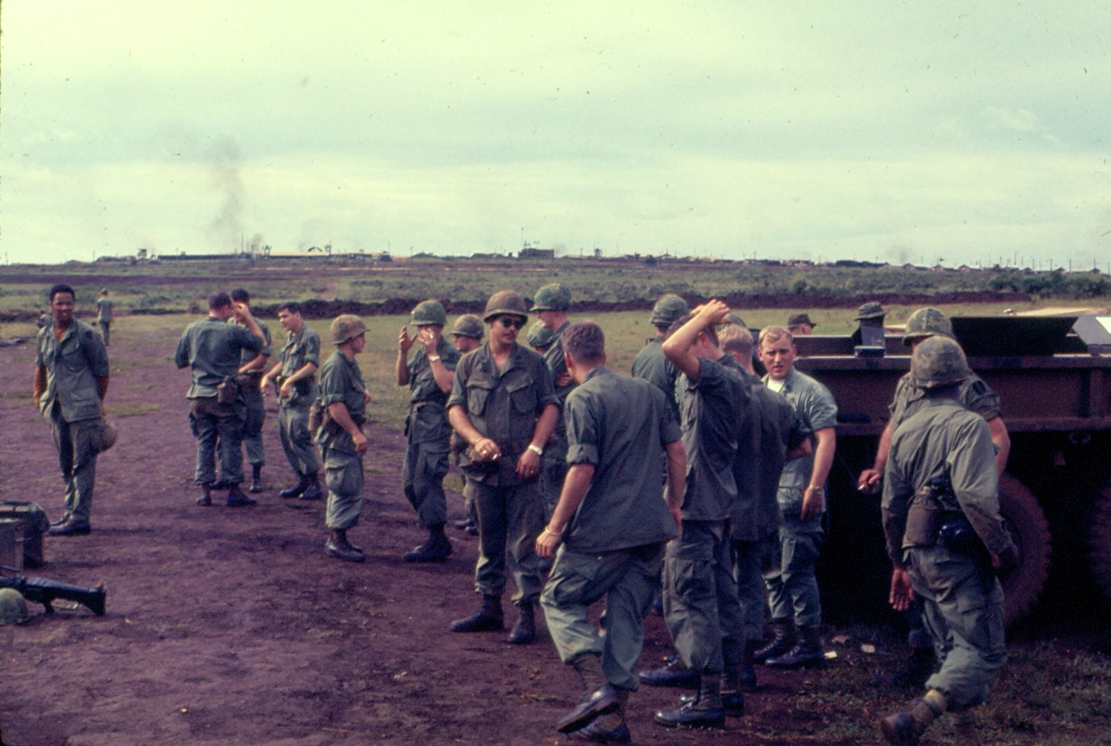 a group of soldiers walking along a field