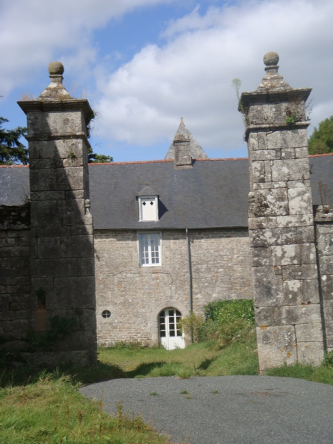 an old stone house has arched windows