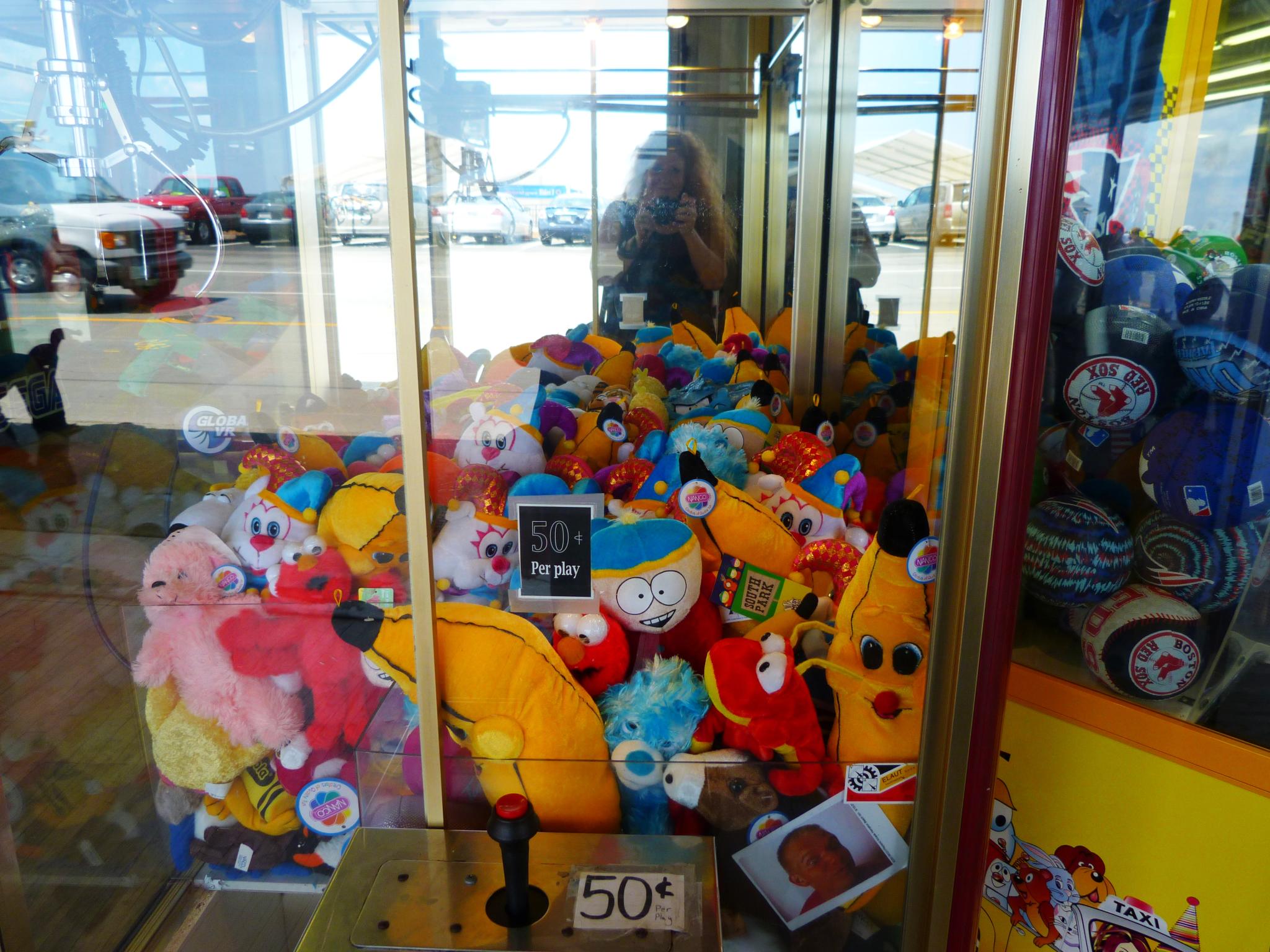 a display case filled with stuffed animals inside of a store