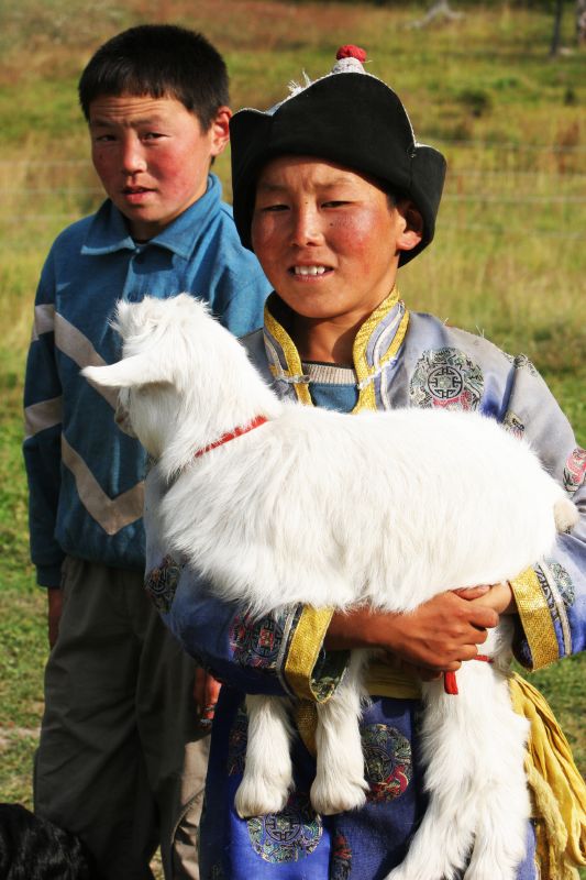 an image of two people with a dog