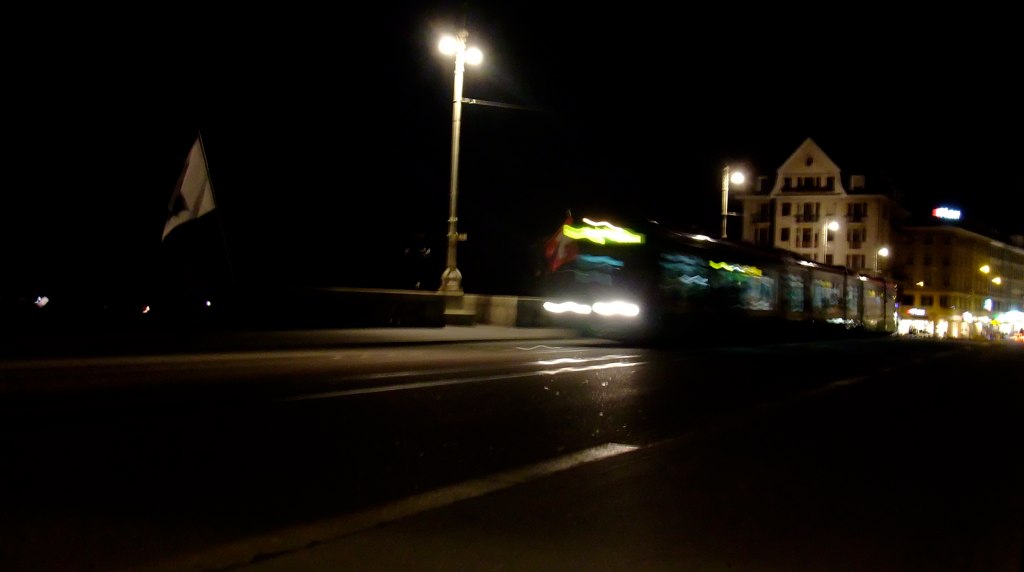an illuminated po of a street at night