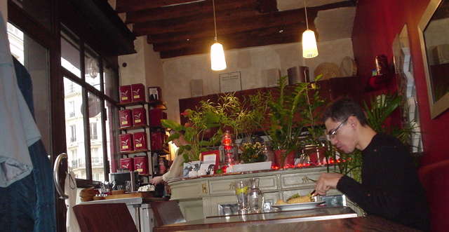 a man that is sitting at a bar  some food