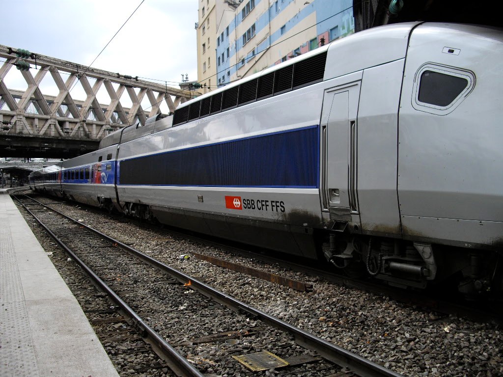 the high speed train is stopped on the railroad tracks