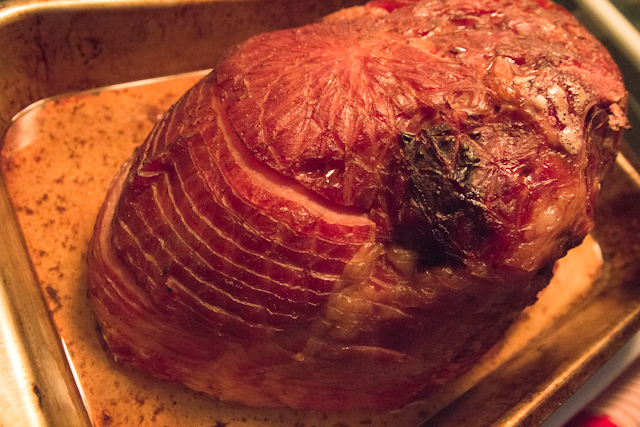 a close up of a meat with sauce and herbs