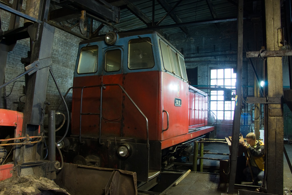 a train is parked in an abandoned building
