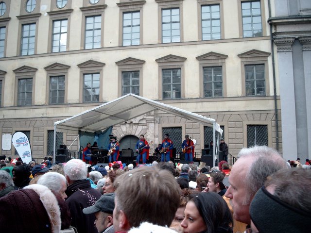 a group of people are watching people performing on the stage