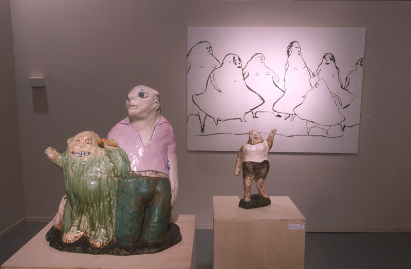 sculptures on pedestals in a museum like setting