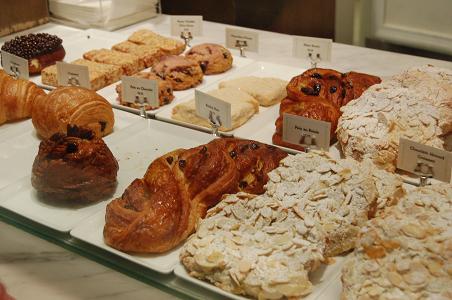 assortment of baked goods displayed on a counter top