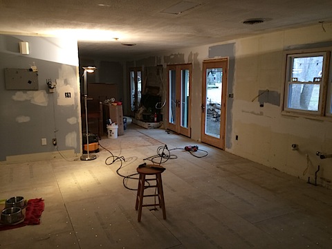 a living room being remodeled with an allure of paint