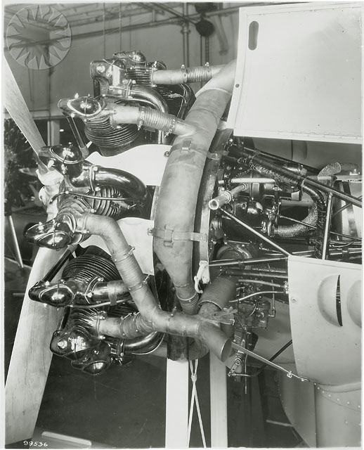 a black and white po of an engine with propeller