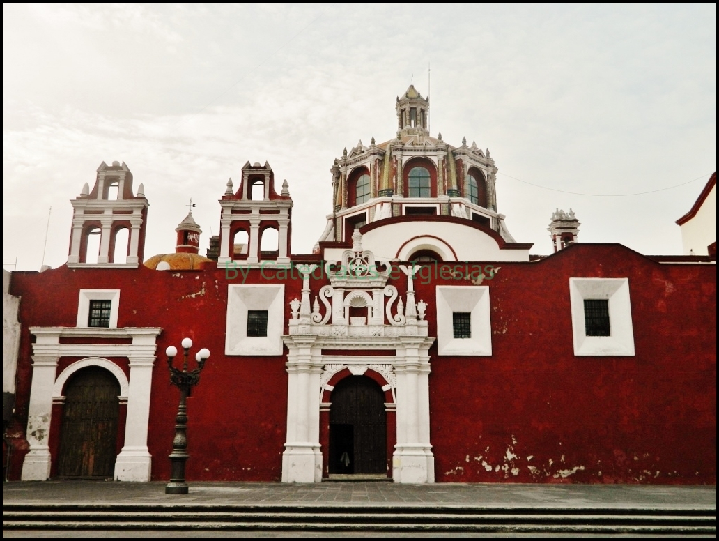 an old and very large building with two towers