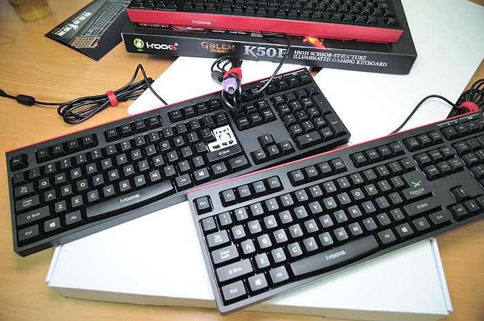 three computer keyboards sitting on top of a table