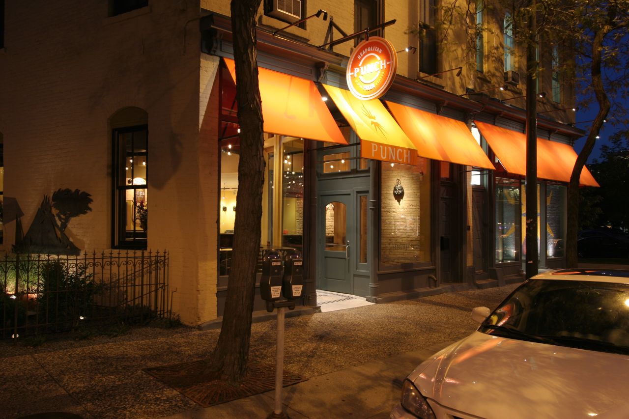 the exterior of an upscale el with bright lighting