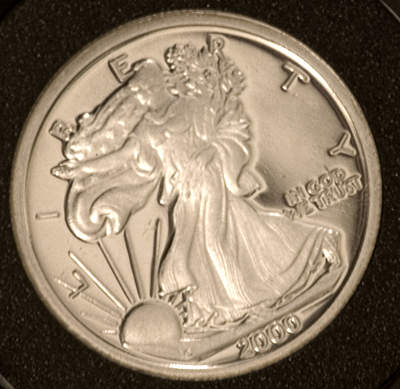 a coin with an angel image on it