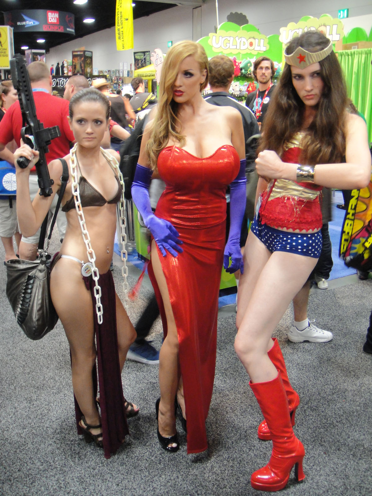 two woman dressed up like bombs and another women in costumes