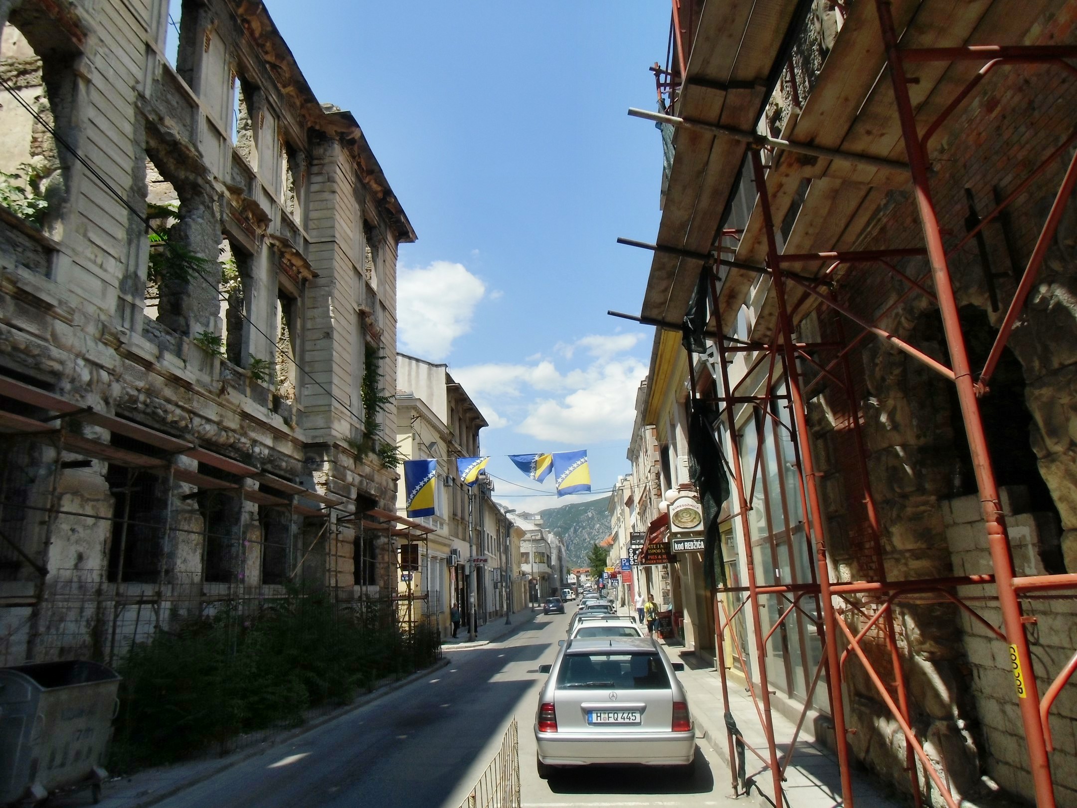 a view of some cars parked on the side of a road