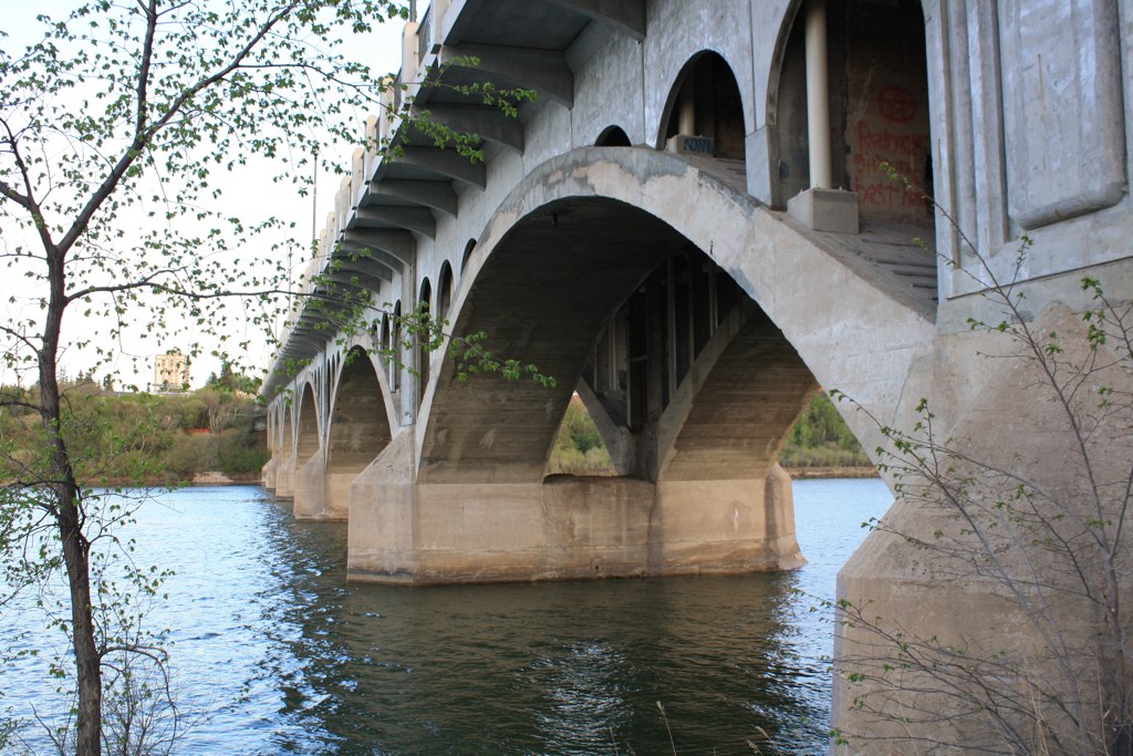 the water below the bridge is clear and clean