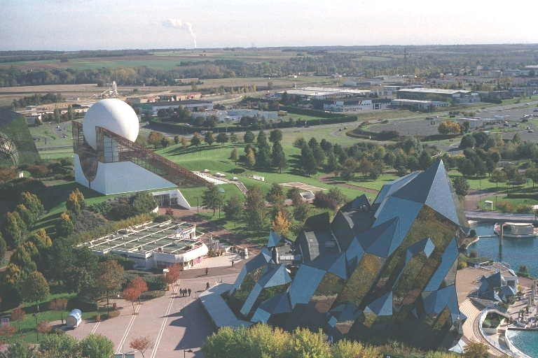 an aerial view of the building in which the large, wavy object is located