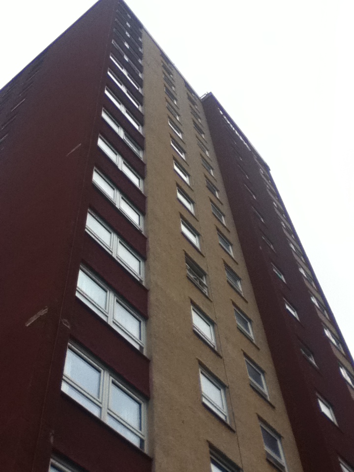 this is a view of a tall building looking up at the ground