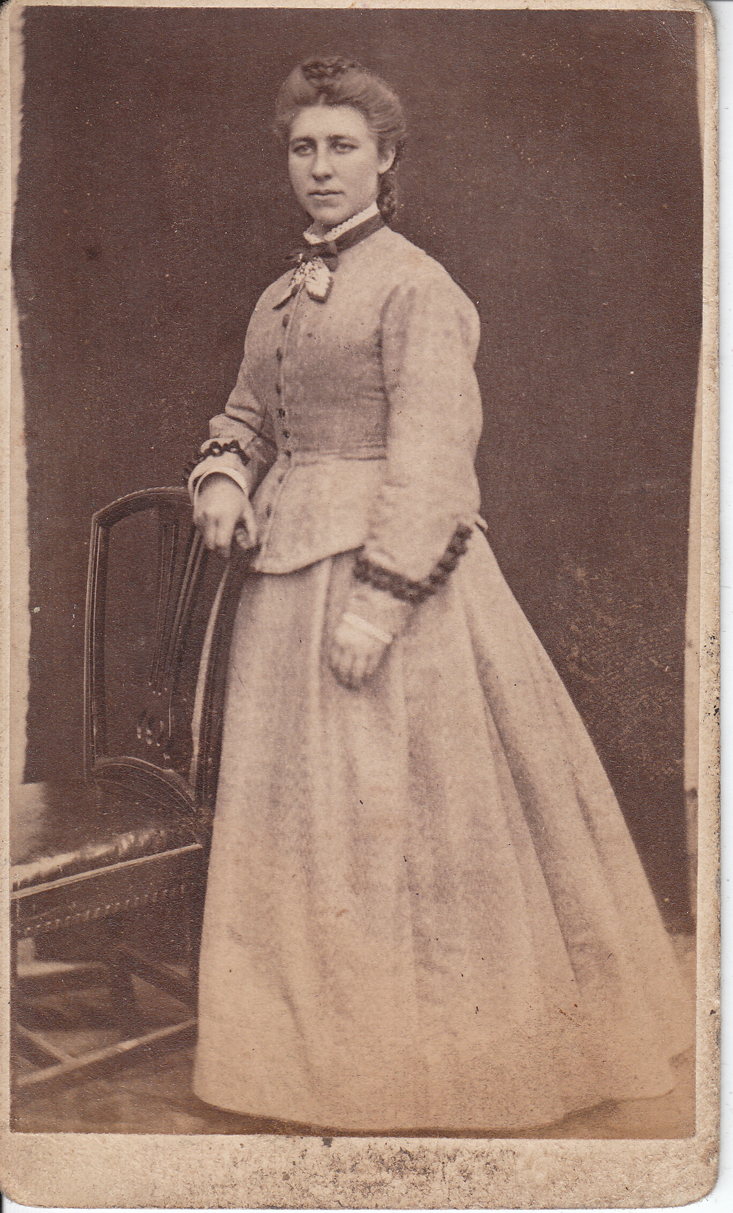 old fashion pograph of a woman with large dress