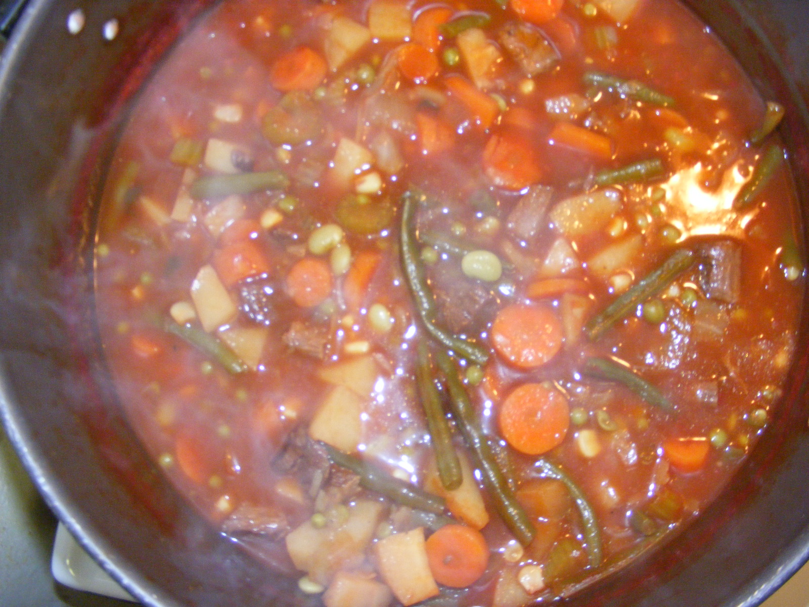 a stew is prepared and sitting in a large pot