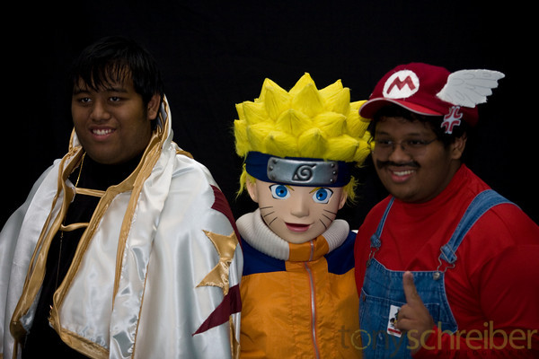 three men in costumes standing next to each other