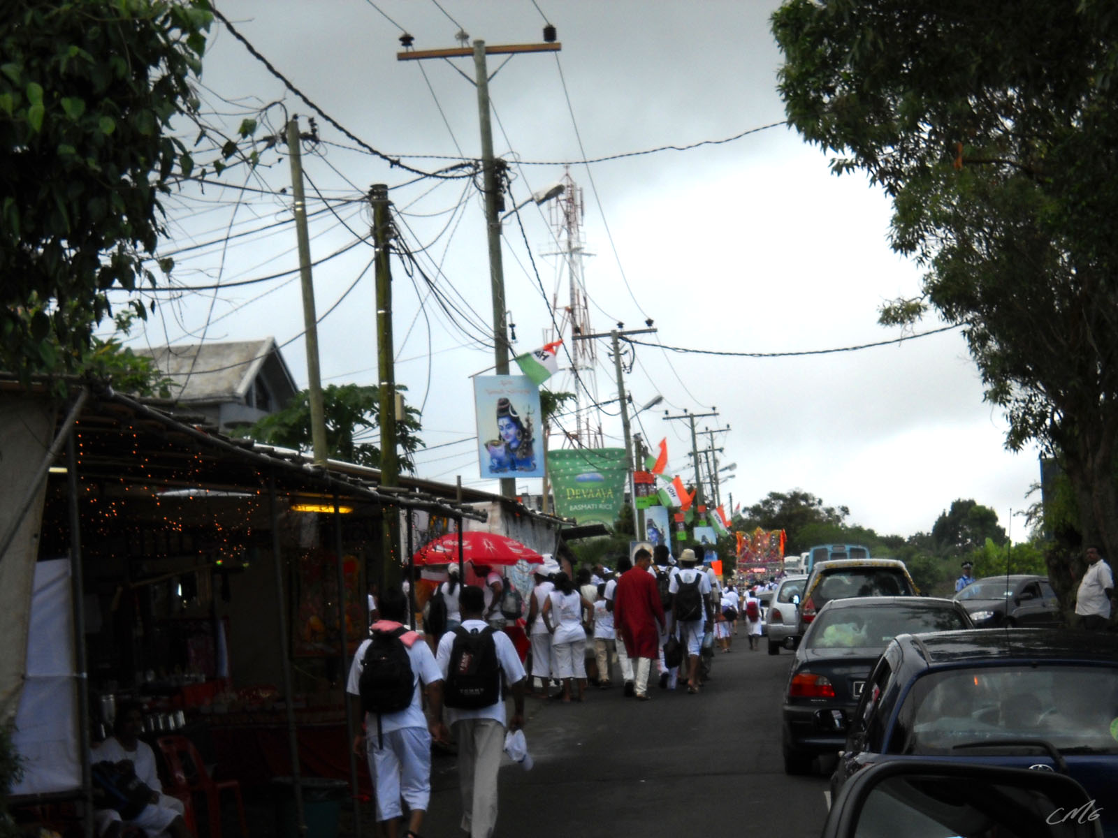 a group of people walk on the street together