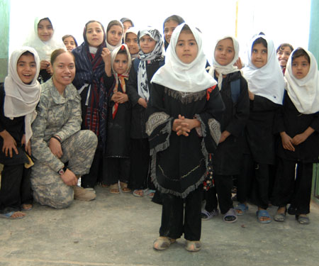 a large group of women and children in their military uniforms