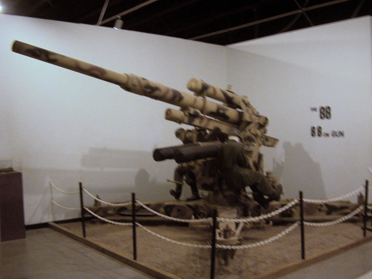 military weapon displayed in museum exhibit in concrete