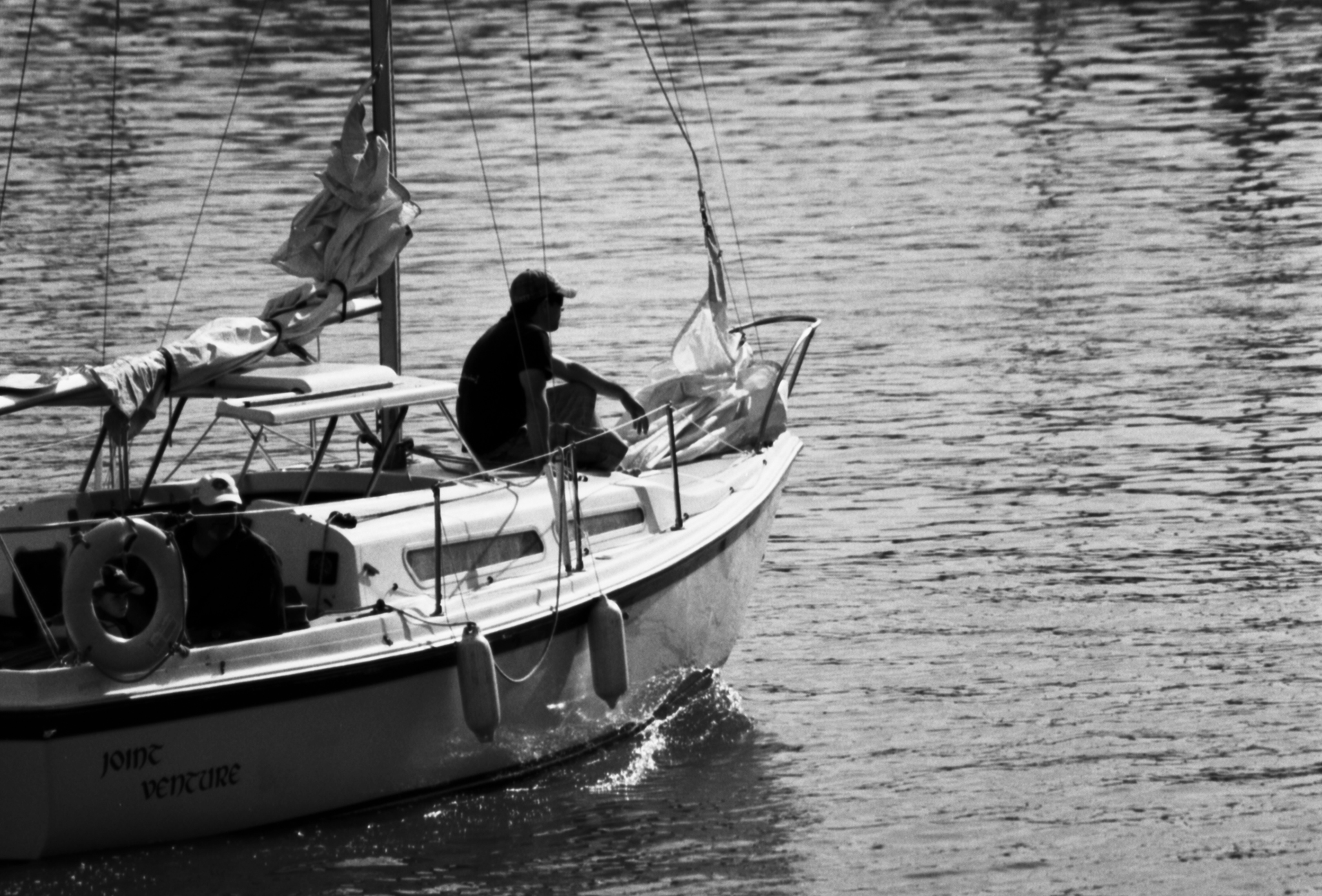 a man is riding a boat in the middle of the water