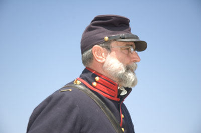 a soldier with a big beard wearing his uniform