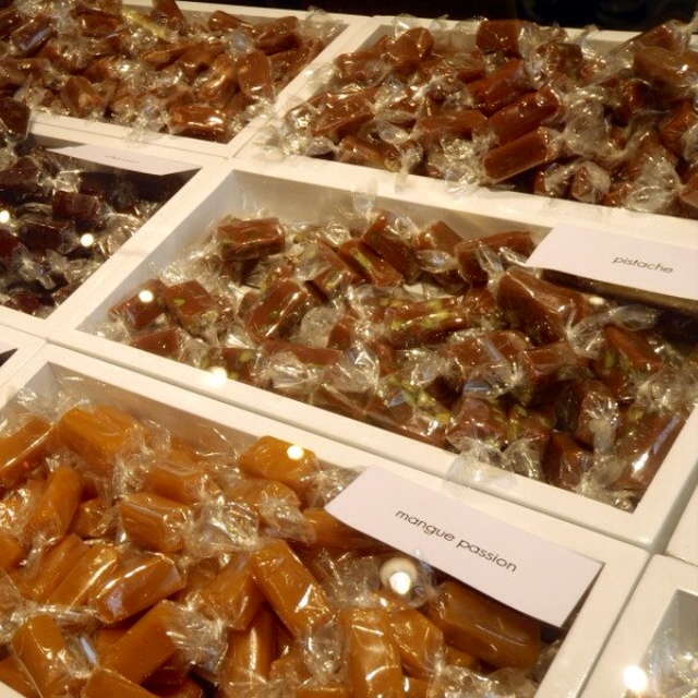 a close up of many trays of different candies