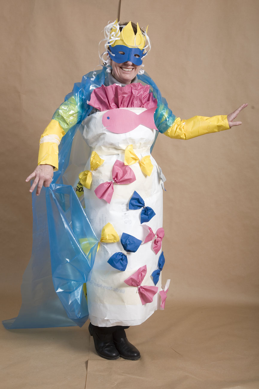 a woman wearing a costume made out of plastic
