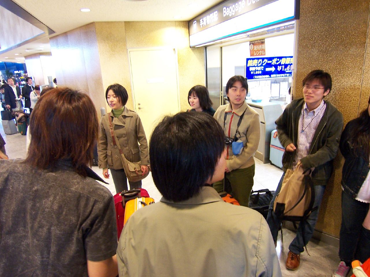 several people in a line in an elevator
