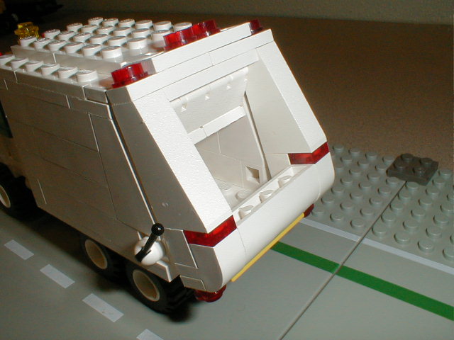 a toy truck with its doors open on top of a table