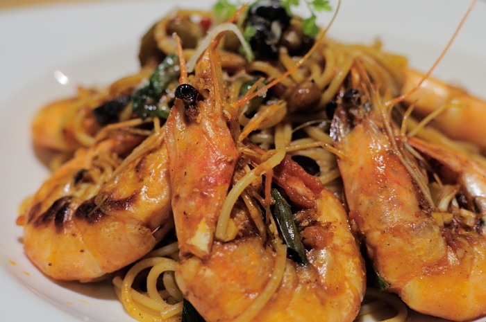 a plate of food with noodles and shrimp